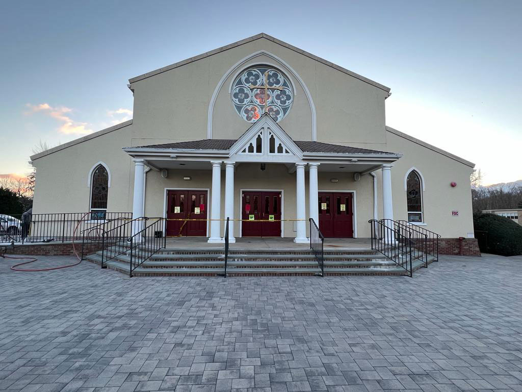 Large commercial paver plaza and steps at a church entrance